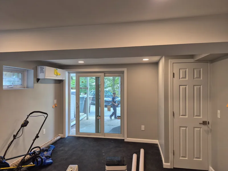 Basement finished with drywall and recessed lighting